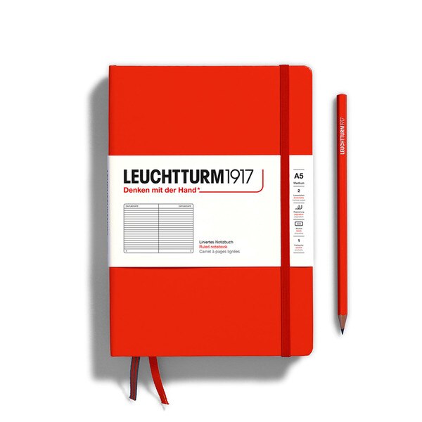 A fox red colored hardcover notebook.